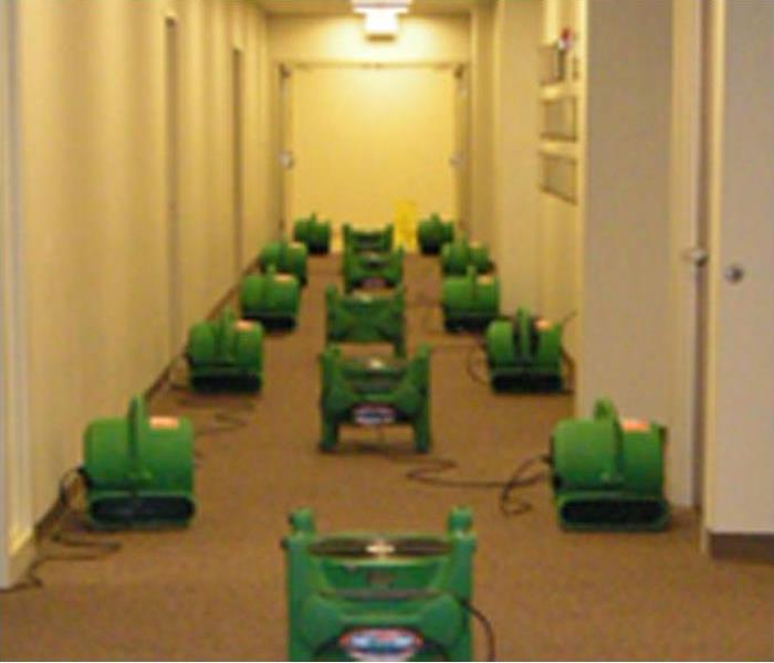 SERVPRO drying equipment lined up in a hallway